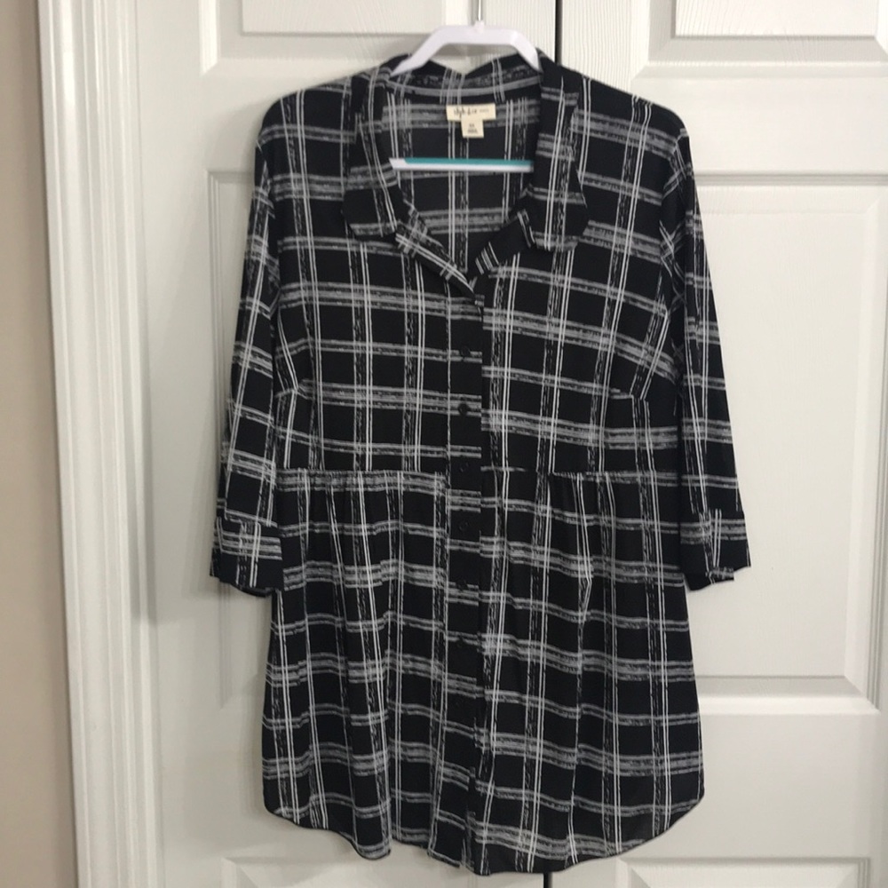 Ladies button up 3/4 length sleeve blouse. 100 % Nylon